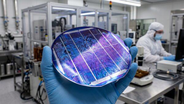 Advanced perovskite silicon tandem solar cell wafer reflecting shimmering violet and blue coatings